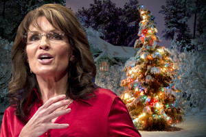 Sarah Palin stands before an erect Christmas tree.